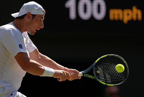 Valentin Royer of France plays a backhand against Alexander Zverev of Germany in their second round men's singles match at the Wimbledon Tennis Championships in London, Thursday, July 2, 2026