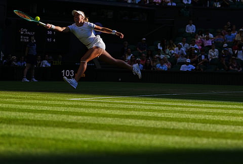 Caty Mcnally of the United States plays a return during the second round women's singles match against Elena Rybakina of Kazakhstan at the Wimbledon Tennis Championships in London, Thursday, July 2, 2026.