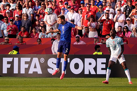 Croatia's Josip Stanisic (2) heads the ball as Portugal's Rafael Leao (17) looks on during the World Cup round of 32 soccer match between Portugal and Croatia in Toronto, Thursday, July 2, 2026.