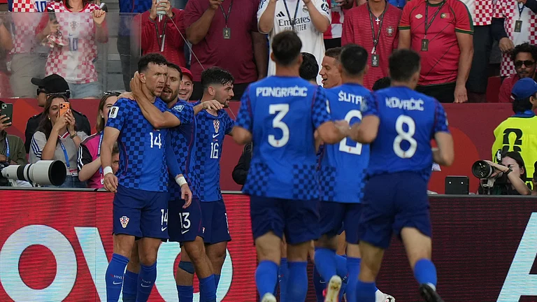 Croatia's Ivan Perisic (14) is congratulated by his teammates after scoring his side's first goal against Portugal during the World Cup round of 32 soccer match in Toronto, Thursday, July 2, 2026. - (AP Photo/Stephanie Scarbrough)