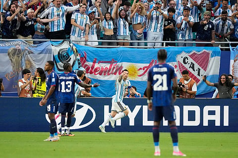 Argentina's Lionel Messi (10) celebrates after scoring their first goal during the World Cup round of 32 soccer match between Argentina and Cape Verde in Miami Gardens