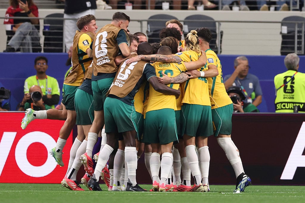 Australia players celebrate after Egypts Mohamed Hany scored an own goal during the World Cup round of 32 soccer match between Australia and Egypt in Arlington