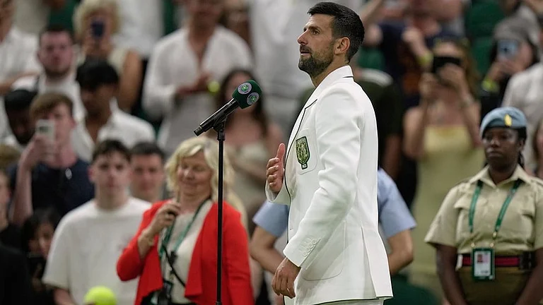 Novak Djokovic of Serbia speaks to the public after his victory against Stefanos Tsitsipas of Greece in their second round men's singles match at the Wimbledon Tennis Championships in London, Wednesday, July 1, 2026. - | Photo: AP/Brian Inganga