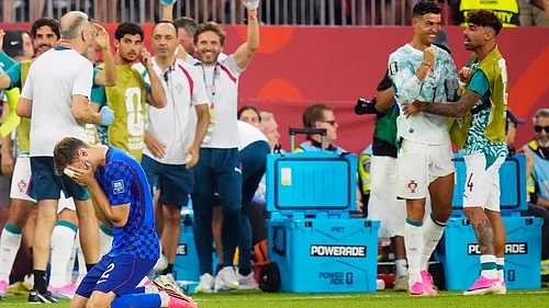 Chris Young/AP Photo : Croatias Josip Stanisic (2) reacts as a goal is disallowed as Portugals Cristiano Ronaldo, second right, celebrates during the second half of a World Cup round of 32 soccer match