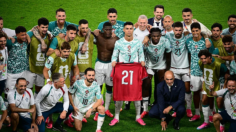 Portugal's Cristiano Ronaldo (7), joined by teammates, holds the jersey of the late Diogo Jota, who died last year, after the World Cup round of 32 soccer match between Portugal and Croatia in Toronto, Thursday, July 2, 2026. - (Sammy Kogan/The Canadian Press via AP)