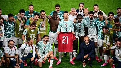 (Sammy Kogan/The Canadian Press via AP) : Portugals Cristiano Ronaldo (7), joined by teammates, holds the jersey of the late Diogo Jota, who died last year, after the World Cup round of 32 soccer match between Portugal and Croatia in Toronto, Thursday, July 2, 2026.