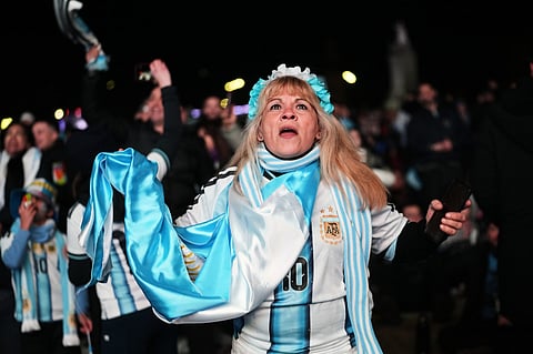 A fan watches the World Cup round of 32 soccer match between Argentina and Cape Verde in Buenos Aires