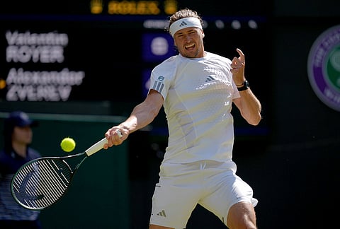 Alexander Zverev of Germany plays a forehand against Valentin Royer of France in their second round men's singles match at the Wimbledon Tennis Championships in London, Thursday, July 2, 2026. 
