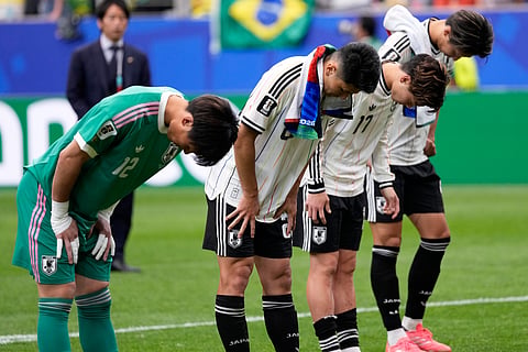 Japan players bow after the World Cup round of 32 soccer match between Brazil and Japan in Houston, Monday, June 29, 2026.