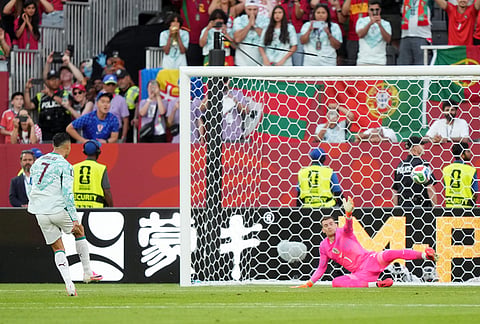 Portugal's Cristiano Ronaldo (7) scores on a penalty kick past Croatia goalkeeper Dominik Livakovic (1) during the World Cup round of 32 soccer match between Portugal and Croatia in Toronto, Thursday, July 2, 2026. 
