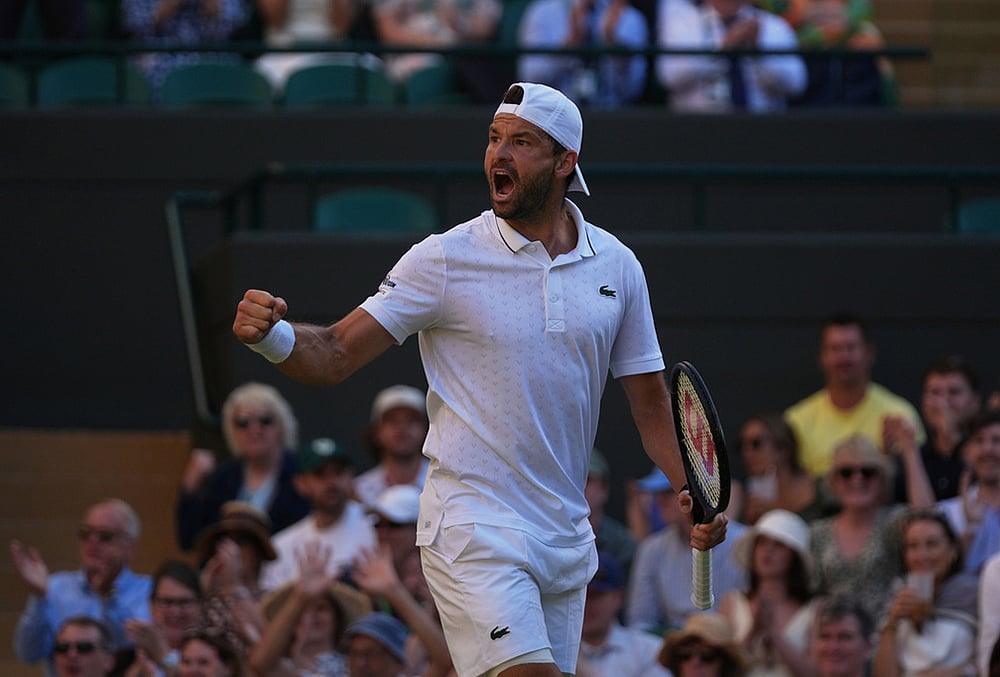 Grigor Dimitrov of Bulgaria celebrates winning the first set against Jakub Mensik of Czech Republic in their second round men's singles match at the Wimbledon Tennis Championships in London, Thursday, July 2, 2026.  - | Photo: AP/Maja Smiejkowska
