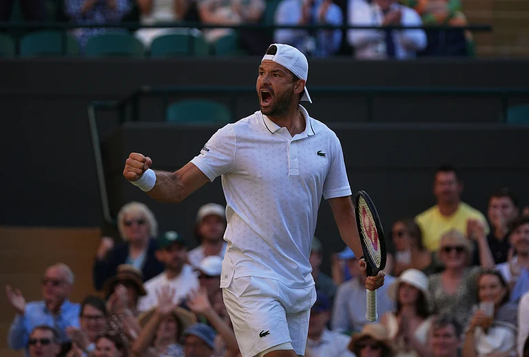 Grigor Dimitrov of Bulgaria celebrates winning the first set against Jakub Mensik of Czech Republic in their second round men's singles match at the Wimbledon Tennis Championships in London, Thursday, July 2, 2026. - | Photo: AP/Maja Smiejkowska