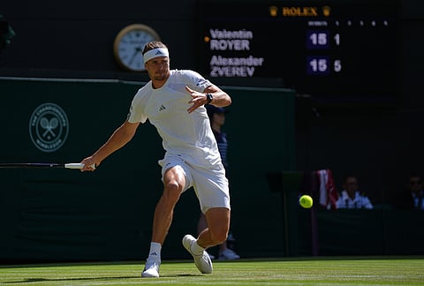 Alexander Zverev of Germany returns the ball to Valentin Royer of France in their second round men's singles match at the Wimbledon Tennis Championships in London, Thursday, July 2, 2026. 