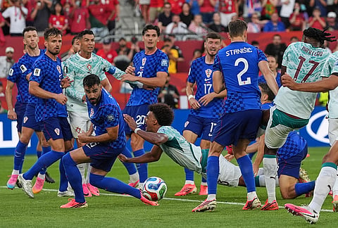 Portugal's Renato Veiga (13) is fouled to concede a penalty during the World Cup round of 32 soccer match between Portugal and Croatia in Toronto, Thursday, July 2, 2026.