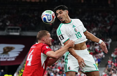 Algeria's Fares Chaibi (10) heads the ball over Switzerland's Nico Elvedi (4) during the World Cup round of 32 soccer match between Switzerland and Algeria in Vancouver, British Columbia, Thursday, July 2, 2026