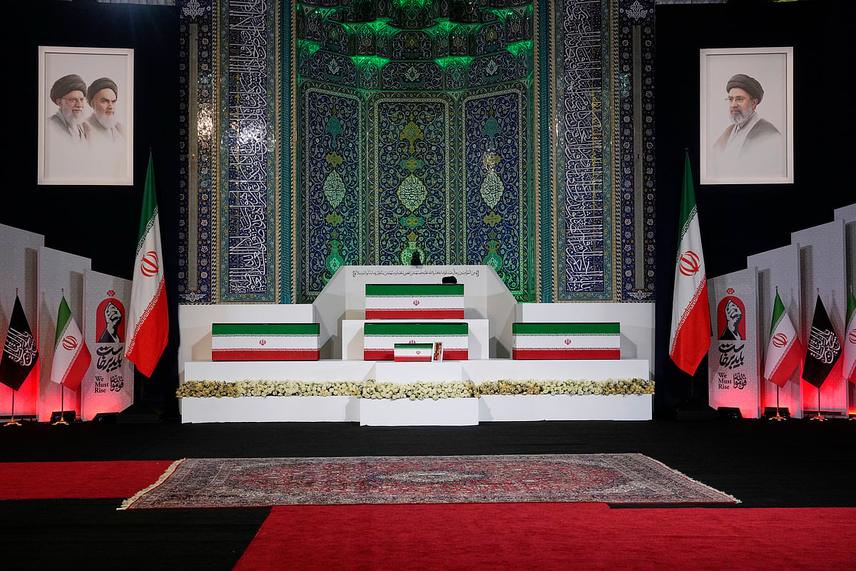 The coffins of slain Iranian Supreme Leader Ayatollah Ali Khamenei, center on top, and members of his family are displayed ahead of the dayslong funeral ceremonies at the Imam Khomeini Mosalla Grand Mosque in Tehran, Iran, Friday, July 3, 2026.  - (AP Photo/Vahid Salemi)
