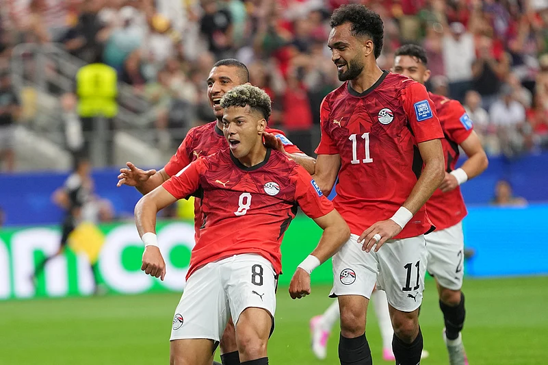 Egypts Emam Ashour celebrates scoring the opening goal during a World Cup round of 32 soccer match between Australia and Egypt in Arlington