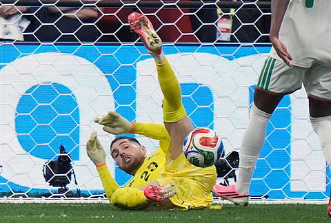 Algeria goalkeeper Luca Zidane (23) makes a save during the World Cup round of 32 soccer match between Switzerland and Algeria in Vancouver, British Columbia, Thursday, July 2, 2026. 