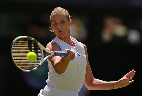 Karolina Pliskova of the Czech Republic returns the ball during the second round women's singles match against Iga Swiatek of Poland at the Wimbledon Tennis Championships in London, Thursday, July 2, 2026.