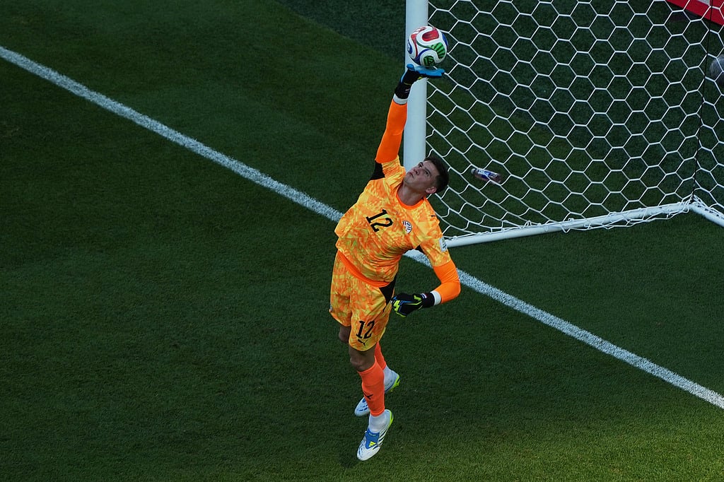 Paraguay goalkeeper Orlando Gill makes a save during the World Cup round of 16 soccer match against France in Philadelphia
