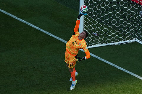 Paraguay goalkeeper Orlando Gill makes a save during the World Cup round of 16 soccer match against France in Philadelphia