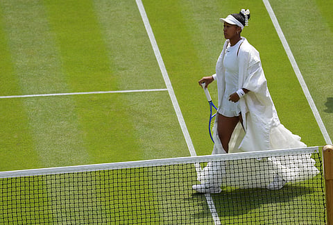 Naomi Osaka of Japan arrives on court to play against Daria Kasatkina of Australia in their third round women's singles match at the Wimbledon Tennis Championships in London, Friday, July 3, 2026. 