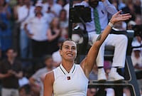 | Photo: AP/Kin Cheung : Aryna Sabalenka of Belarus celebrates her victory against Jelena Ostapenko of Latvia in their third round women's singles match at the Wimbledon Tennis Championships in London, Friday, July 3, 2026.
