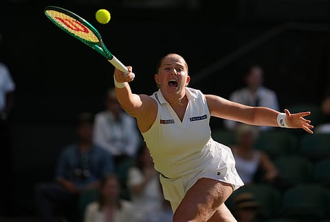 Jelena Ostapenko of Latvia returns the ball to Aryna Sabalenka of Belarus in their third round women's singles match at the Wimbledon Tennis Championships in London, Friday, July 3, 2026. 