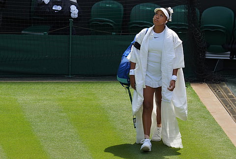 Naomi Osaka of Japan arrives on court 1 to play against Daria Kasatkina of Australia in their third round women's singles match at the Wimbledon Tennis Championships in London, Friday, July 3, 2026. 
