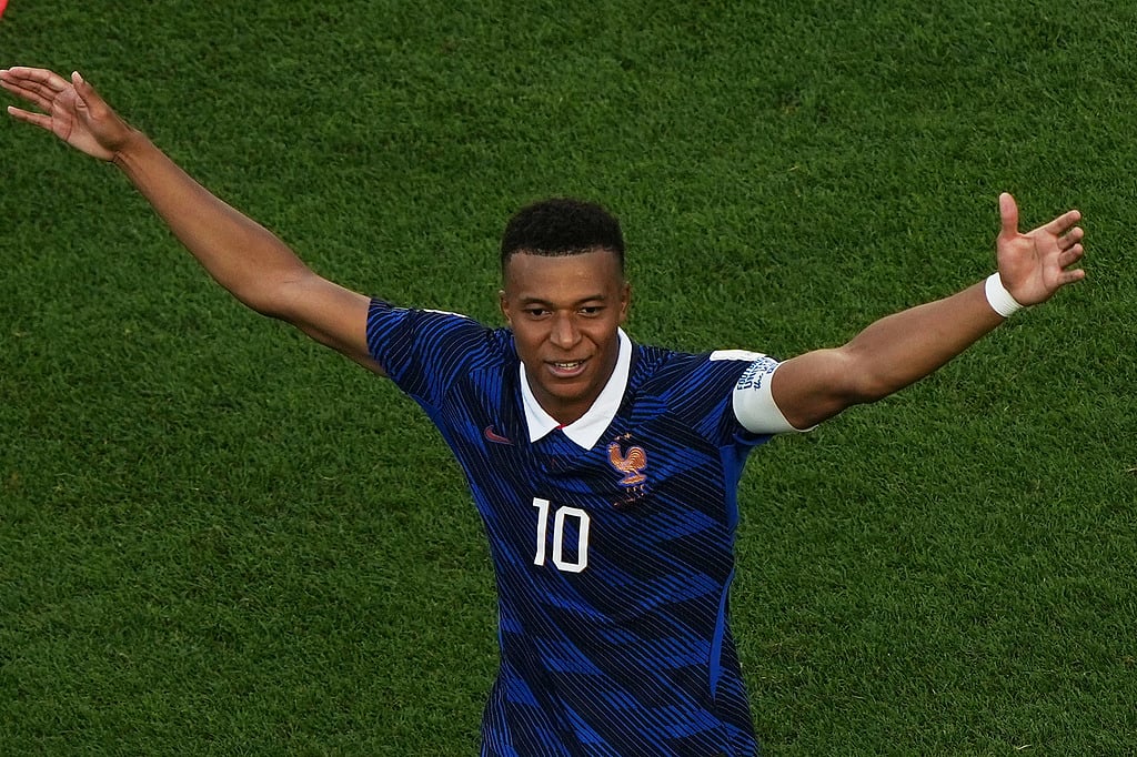 Frances Kylian Mbappe celebrates after scoring the opening goal from the penalty spot against Paraguay during the World Cup round of 16 soccer match in Philadelphia