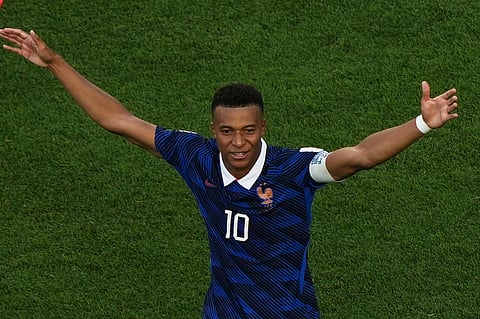 France's Kylian Mbappe celebrates after scoring the opening goal from the penalty spot against Paraguay during the World Cup round of 16 soccer match in Philadelphia