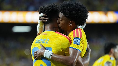 Colombia's Luis Suarez left, and Johan Mojica celebrate after his teammate Jhon Arias scored the opening goal during the World Cup round of 32 soccer match between Colombia and Ghana in Kansas City, Mo., Friday, July 3, 2026.
