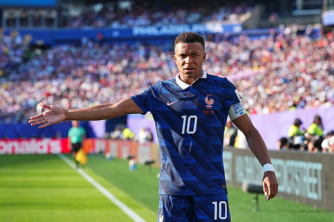 France's Kylian Mbappe (10) gestures during the World Cup round of 16 soccer match between Paraguay and France in Philadelphi