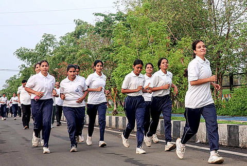 Government Railway Police (GRP) personnel take part in a marathon, in Bhopal, Madhya Pradesh.