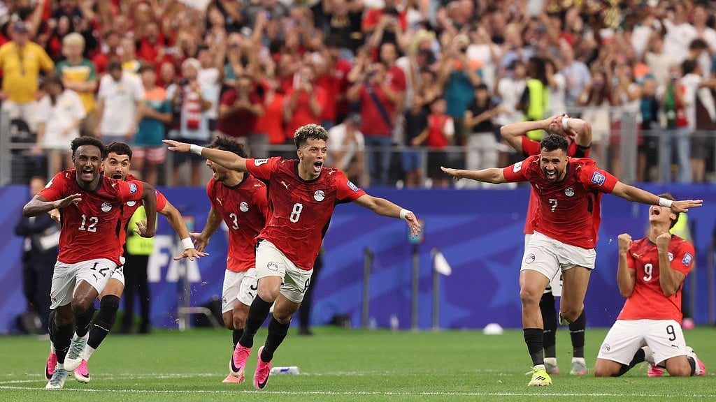 Egypts players celebrate after their teammate Hossam Abdelmaguid (4) score the winning penalty during World Cup round of 32 soccer match between Australia and Egypt in Arlington, Texas, near Dallas, Tuesday, Friday, July 3, 2026.  - AP Photo/Sam Hodde