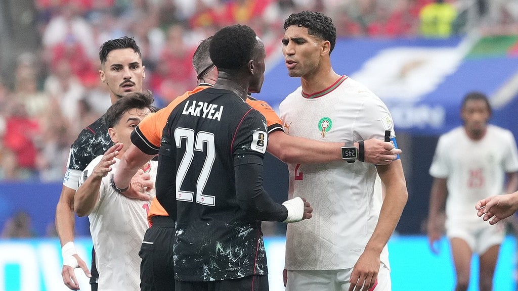 Canada's Richie Laryea, left, and Morocco's Achraf Hakimi argue during the World Cup round of 16 soccer match between Canada and Morocco in Houston - Eric Gay/AP Photo
