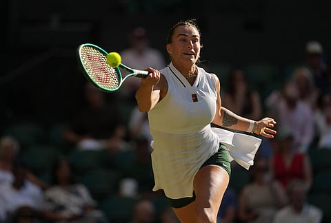 Aryna Sabalenka of Belarus returns the ball to Jelena Ostapenko of Latvia in their third round women's singles match at the Wimbledon Tennis Championships in London, Friday, July 3, 2026.
