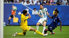 Argentina's Lionel Messi (10) scores their first goal against Cape Verde goalkeeper Vozinha (1) during the World Cup round of 32 soccer match between Argentina and Cape Verde in Miami Gardens, Fla., Friday, July 3, 2026. - AP Photo/George Walker IV