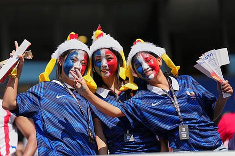Soccer fans pose for a picture ahead of the World Cup round of 16 soccer match between Paraguay and France in Philadelphia