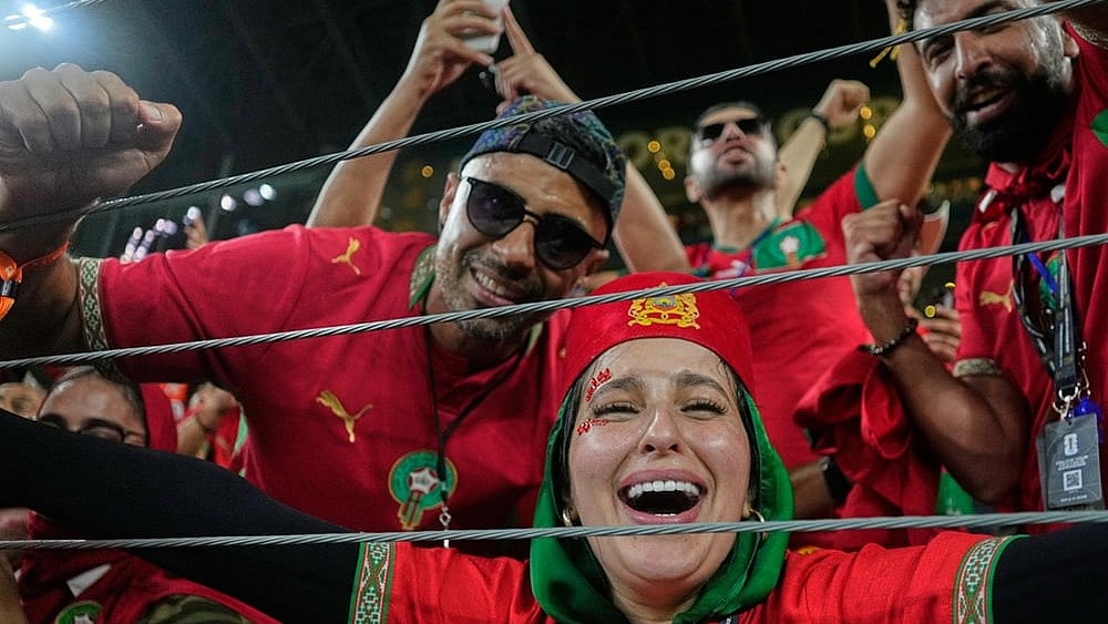 Moroccan fans celebrate following the World Cup round of 32 soccer match between the Netherlands and Morocco in Guadalupe, near Monterrey, Mexico. - | Photo: AP/Ricardo Mazalan