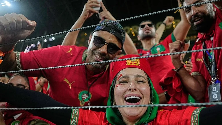 Moroccan fans celebrate following the World Cup round of 32 soccer match between the Netherlands and Morocco in Guadalupe, near Monterrey, Mexico. - | Photo: AP/Ricardo Mazalan