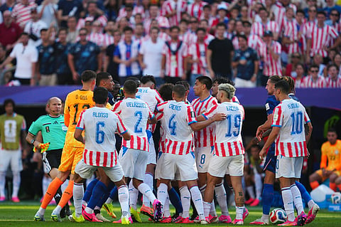 A scuffle starts among the players during the World Cup round of 16 soccer match between Paraguay and France in Philadelphia,