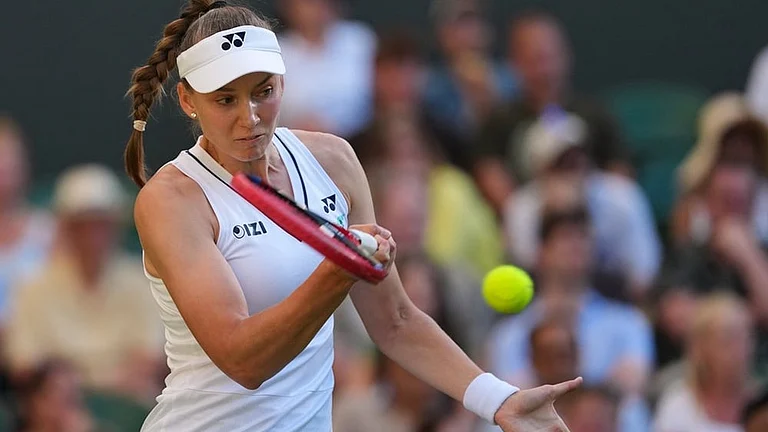 Elena Rybakina of Kazakhstan plays a return during the second round women's singles match against Caty Mcnally of the United States at the Wimbledon Tennis Championships in London, Thursday, July 2, 2026. - | Photo: AP/Kirsty Wigglesworth