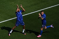 Matt Rourke/AP Photo : France's Kylian Mbappe, left, and France's Lucas Digne wave to fans during the warm up before the World Cup round of 16 soccer match against Paraguay in Philadelphia.