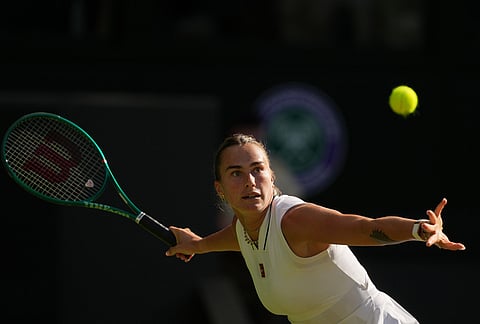 Aryna Sabalenka of Belarus returns the ball to Jelena Ostapenko of Latvia in their third round women's singles match at the Wimbledon Tennis Championships in London, Friday, July 3, 2026.

