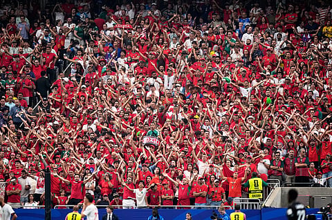 Morocco's fans cheer during the World Cup round of 16 soccer match between Canada and Morocco in Houston