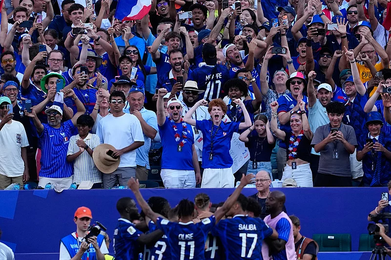 Fans react after Frances Kylian Mbappe scored his sides opening goal against Paraguay during the World Cup round of 16 soccer match in Philadelphia