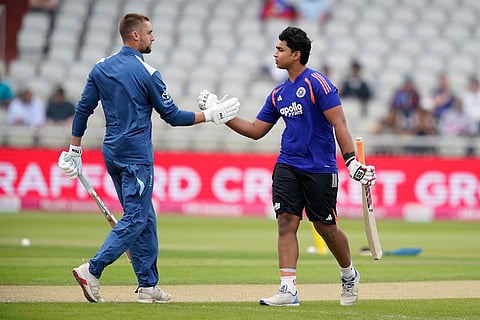 India's Vaibhav Sooryavanshi, right, shakes hands with England's Will Jacks before the start of the T20 cricket match between England and India in Manchester, England.