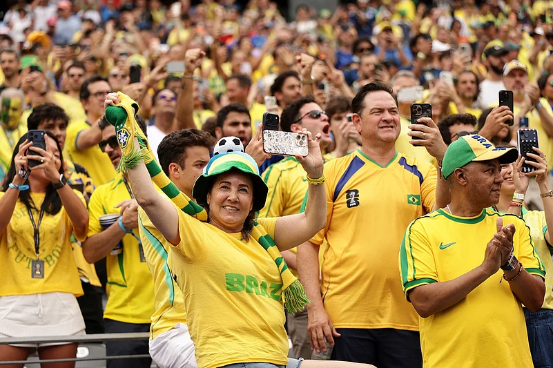 Fans of Brazil cheer from the stands ahead of the World Cup round of 16 soccer match between Brazil and Norway in East Rutherford,