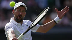 Novak Djokovic of Serbia returns the ball to Roman Saffiulin of Russia in their fourth round men's singles match at the Wimbledon Tennis Championships in London - Brian Inganga/AP Photo